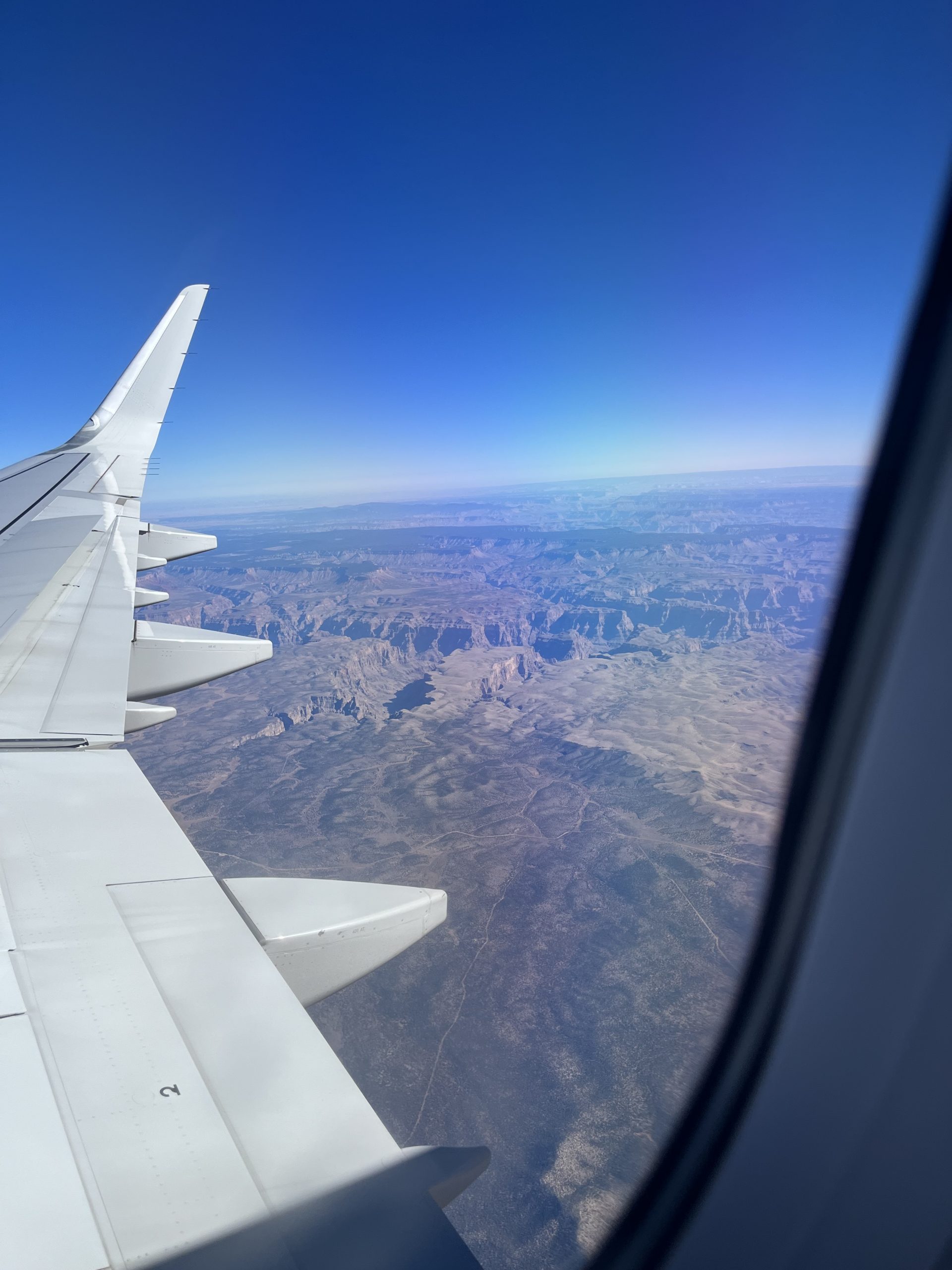 Image from an airplane seat showing a great view of the Grand Canyon